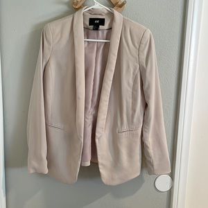 Light pink tuxedo style blazer with open front